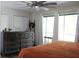 Relaxing bedroom with natural light, a view to a screened in porch, and wood accents at 301 Orange Blossom Dr, Winter Haven, FL 33880