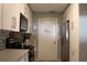 Bright kitchen features stainless steel appliances, stylish backsplash, and ample cabinet space at 301 Orange Blossom Dr, Winter Haven, FL 33880