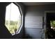 Corner window in the living room with views of the yard and greenery at 301 Orange Blossom Dr, Winter Haven, FL 33880