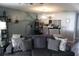 Comfortable living room with an open layout, modern decor, and an adjacent kitchen area at 301 Orange Blossom Dr, Winter Haven, FL 33880