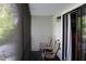 A relaxing screened in porch with two rocking chairs and view to backyard at 301 Orange Blossom Dr, Winter Haven, FL 33880
