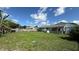 A large backyard with a well-maintained lawn, bordered by a wooden fence, perfect for outdoor living at 3100 Abaco St, Orlando, FL 32827