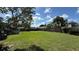 Spacious backyard features lush greenery, a privacy fence, providing plenty of room for outdoor activities at 3100 Abaco St, Orlando, FL 32827