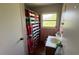 Compact bathroom with a striped shower curtain and pink tile, offering essential amenities and a functional design at 3100 Abaco St, Orlando, FL 32827