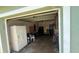Attached garage providing secure parking and extra storage space, with a refrigerator at 3100 Abaco St, Orlando, FL 32827