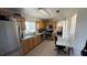 Functional kitchen with stainless steel appliances, ample counter space, and convenient access to additional rooms at 3100 Abaco St, Orlando, FL 32827