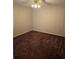A bedroom with striped wallpaper and brown carpet at 341 Sterling Dr, Winter Haven, FL 33884