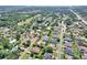An aerial view of a home located in a quiet neighborhood, near a highway, lake, and local golf course at 3522 Royal S Ct, Lakeland, FL 33812