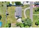 An aerial view shows a well-maintained home with a lush lawn, and a circular driveway at 3522 Royal S Ct, Lakeland, FL 33812