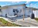 Spacious backyard with patio, a hammock, a grill, and a playhouse at 3522 Royal S Ct, Lakeland, FL 33812