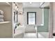 Charming bathroom featuring tiled walls, a vanity with storage, and a shower with a stylish curtain at 3522 Royal S Ct, Lakeland, FL 33812