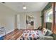 Bright bedroom featuring stylish décor, hardwood floors and natural light at 3522 Royal S Ct, Lakeland, FL 33812