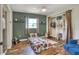 Cozy bedroom with warm wood floors, a closet, and playful decor at 3522 Royal S Ct, Lakeland, FL 33812