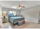 Comfortable bedroom features tile flooring, a ceiling fan, and a cozy atmosphere for relaxation at 3522 Royal S Ct, Lakeland, FL 33812