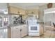 Neutral kitchen featuring wood cabinets and an opening to the dining room at 3522 Royal S Ct, Lakeland, FL 33812