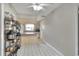 Spacious kitchen with tile floors, neutral color palette, and storage shelves, creating a blank canvas for cooking at 3522 Royal S Ct, Lakeland, FL 33812