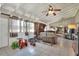 Bright living room with fireplace, vaulted ceilings, bar area and lots of toys at 3522 Royal S Ct, Lakeland, FL 33812