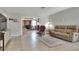 Open-concept living space with tile flooring, a fireplace view, and comfortable furnishings at 3522 Royal S Ct, Lakeland, FL 33812