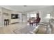 Bright and airy living room featuring tile flooring, a comfortable leather couch, and neutral tones at 3522 Royal S Ct, Lakeland, FL 33812