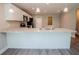 Kitchen with island, breakfast bar seating, stainless steel sink, and granite countertops at 4042 Old Bartow Eagle Lake Rd, Bartow, FL 33830