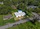 Aerial view showcasing the property's well-manicured lawn and overall curb appeal at 405 S 7Th Ave, Bartow, FL 33830