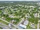 Expansive aerial view of a residential area, featuring houses, trees, and a commercial district at 405 S 7Th Ave, Bartow, FL 33830