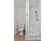 Bathroom featuring toilet, and tiled shower with modern fixtures at 405 S 7Th Ave, Bartow, FL 33830