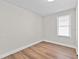 Bright bedroom with hardwood flooring and a window offering natural light at 405 S 7Th Ave, Bartow, FL 33830