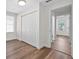 Bedroom with hardwood floors, large closet, and natural light at 405 S 7Th Ave, Bartow, FL 33830