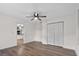 Spacious bedroom featuring hardwood floors, ceiling fan, and closet at 405 S 7Th Ave, Bartow, FL 33830