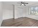 Bedroom with hardwood floors, a closet, and a bright window at 405 S 7Th Ave, Bartow, FL 33830