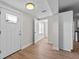 Bright entryway with fresh paint, wood-look flooring, and a front door with glass at 405 S 7Th Ave, Bartow, FL 33830