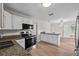 Kitchen features granite countertops, a stainless steel oven, and white cabinets at 405 S 7Th Ave, Bartow, FL 33830