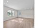 The living room is open and has natural light and wood flooring at 405 S 7Th Ave, Bartow, FL 33830