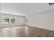 The living room has wood flooring, recessed lighting and plenty of natural light at 405 S 7Th Ave, Bartow, FL 33830