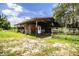 Exterior shot of a horse barn with an open layout, featuring wooden construction at 4510 Cindy Rd, Lakeland, FL 33810