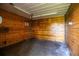 Inside one of the horse stalls featuring solid wood paneling on the walls and an overhead light at 4510 Cindy Rd, Lakeland, FL 33810
