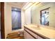Bathroom with marble countertops and shower with wood-look flooring at 4510 Cindy Rd, Lakeland, FL 33810