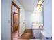 Small bathroom with a single sink and vanity in front of a large mirror at 4510 Cindy Rd, Lakeland, FL 33810