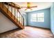 Bedroom with a staircase, light blue walls, and wood-look floors at 4510 Cindy Rd, Lakeland, FL 33810