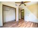 Empty bedroom includes closet and door to ensuite bathroom and ceiling fan at 4510 Cindy Rd, Lakeland, FL 33810