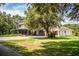 Spacious two-story house with outbuildings and a large paved parking area at 4510 Cindy Rd, Lakeland, FL 33810