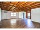 Spacious garage interior with wood beam ceiling and plank flooring at 4510 Cindy Rd, Lakeland, FL 33810