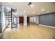 Spacious living area featuring a statement brick wall, stylish staircase, and lots of natural light at 4510 Cindy Rd, Lakeland, FL 33810