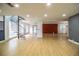 Expansive open-concept living room with light wood floors and a unique spiral staircase at 4510 Cindy Rd, Lakeland, FL 33810