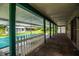 Covered porch with brick floors overlooks a pool and the backyard at 4510 Cindy Rd, Lakeland, FL 33810
