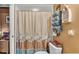 Well-lit bathroom with a neutral shower curtain and a unique boat shelf at 4908 Celia W Cir, Lakeland, FL 33813