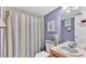 Cozy bathroom features a shower and vanity with bright colored walls at 4908 Celia W Cir, Lakeland, FL 33813
