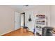 Bedroom with wood floors, multiple closet doors, and bright natural light at 4908 Celia W Cir, Lakeland, FL 33813
