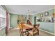 Warm dining room featuring tile floors and a view of the wooden staircase at 4908 Celia W Cir, Lakeland, FL 33813